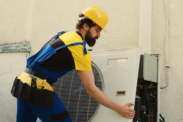 air source heat pump installer UK installing a heat pump